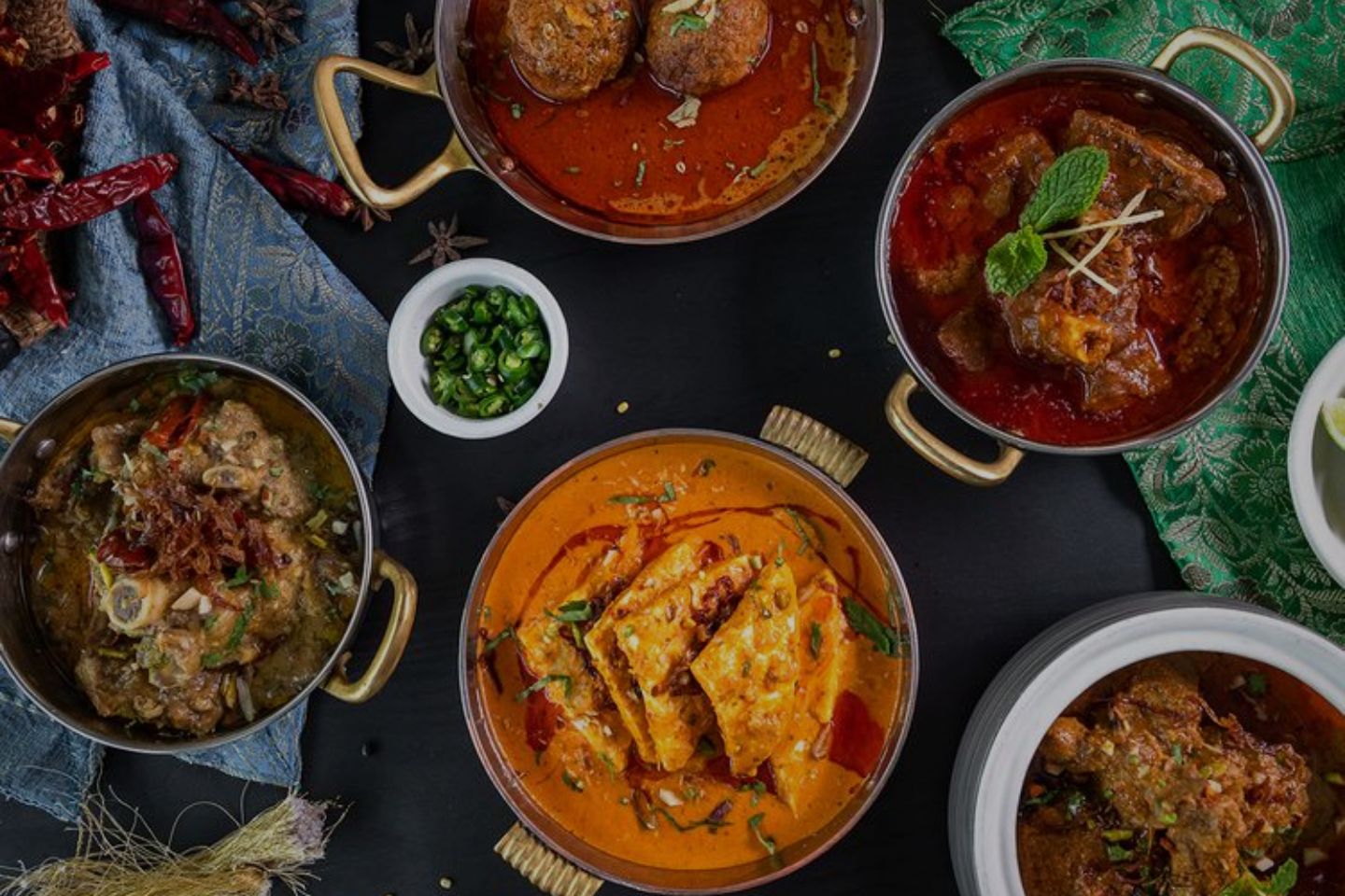 Man pointing at the church in the background at Vertshuset Hotel Madni Royale Ajmer.