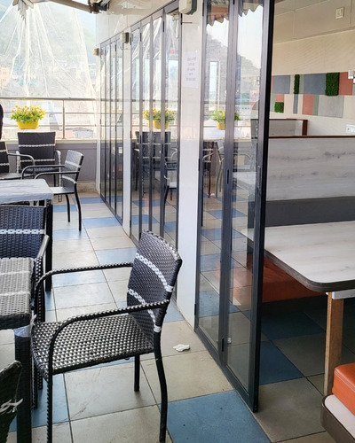 Dining setup at Hotel Madni Royale Ajmer with elegant decor and seating.